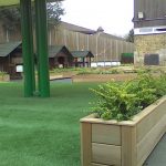 Artifical turf Laid at Cubitt Town Primary school to compliment the handmade cedar wood planters