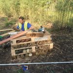 Company Supervisor creating a Bug Hotel in Meath Gardens Childrens Center-min