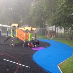 Safety surfacing being laid at Meath Gardens Childrens center by workers of Bow Maintenance and Landscaping-min